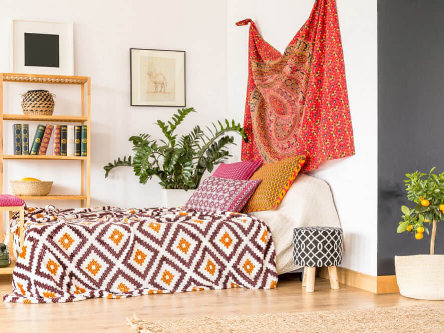 Boho Themed Mayan Style Bedroom With Light Wooden Floorboards